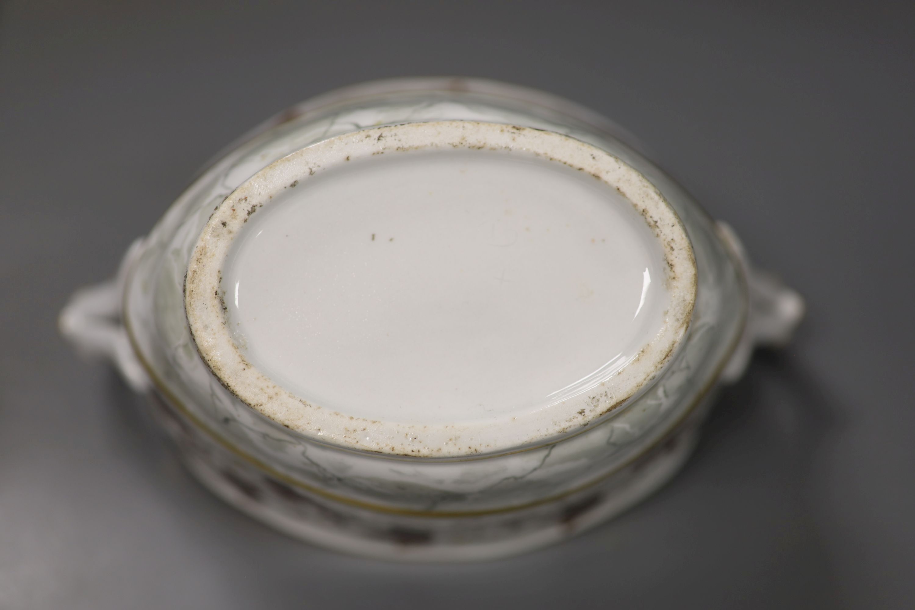A Flight Barr boat shaped sucrier with brown leaves and gilding above a marbled ground,